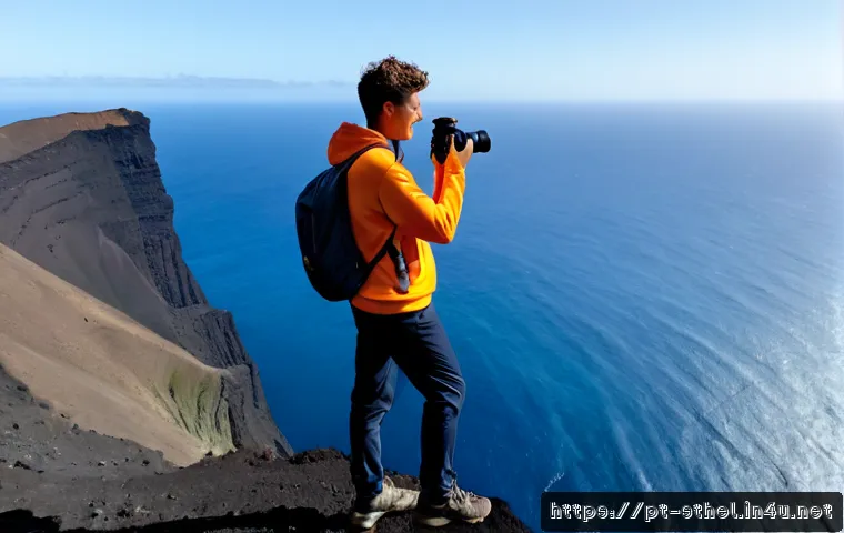 세인트헬레나 여행 유튜버 추천 - Photorealistic travel vlogger standing on a rugged volcanic cliff above the deep blue South Atlantic...